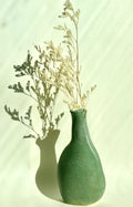 handbuilt green stoneware vase with organic shape bunzy ceramics vase in soft green glaze with dried florals