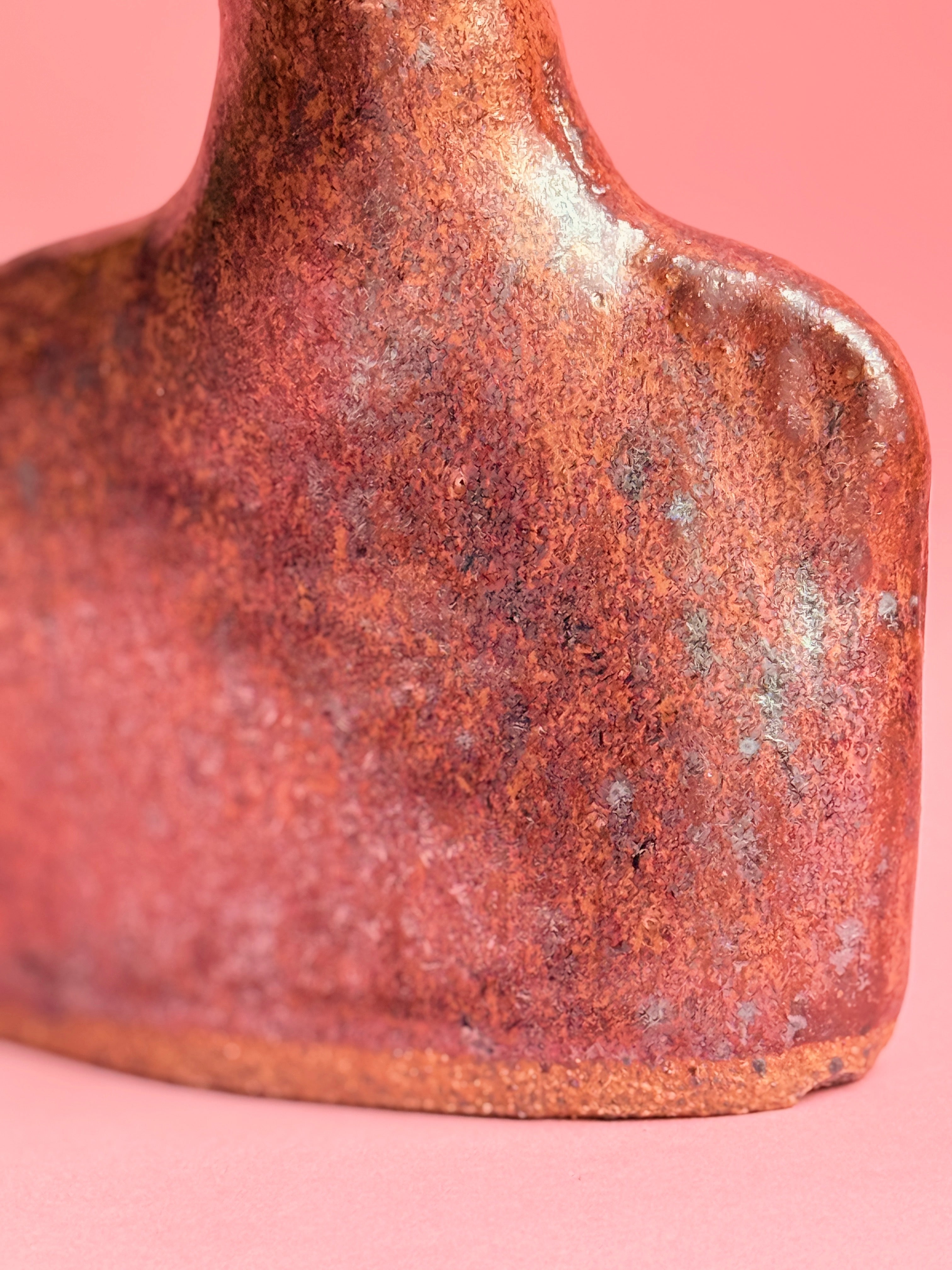 Bun Bun ceramic sculpture with warm copper glaze floating form