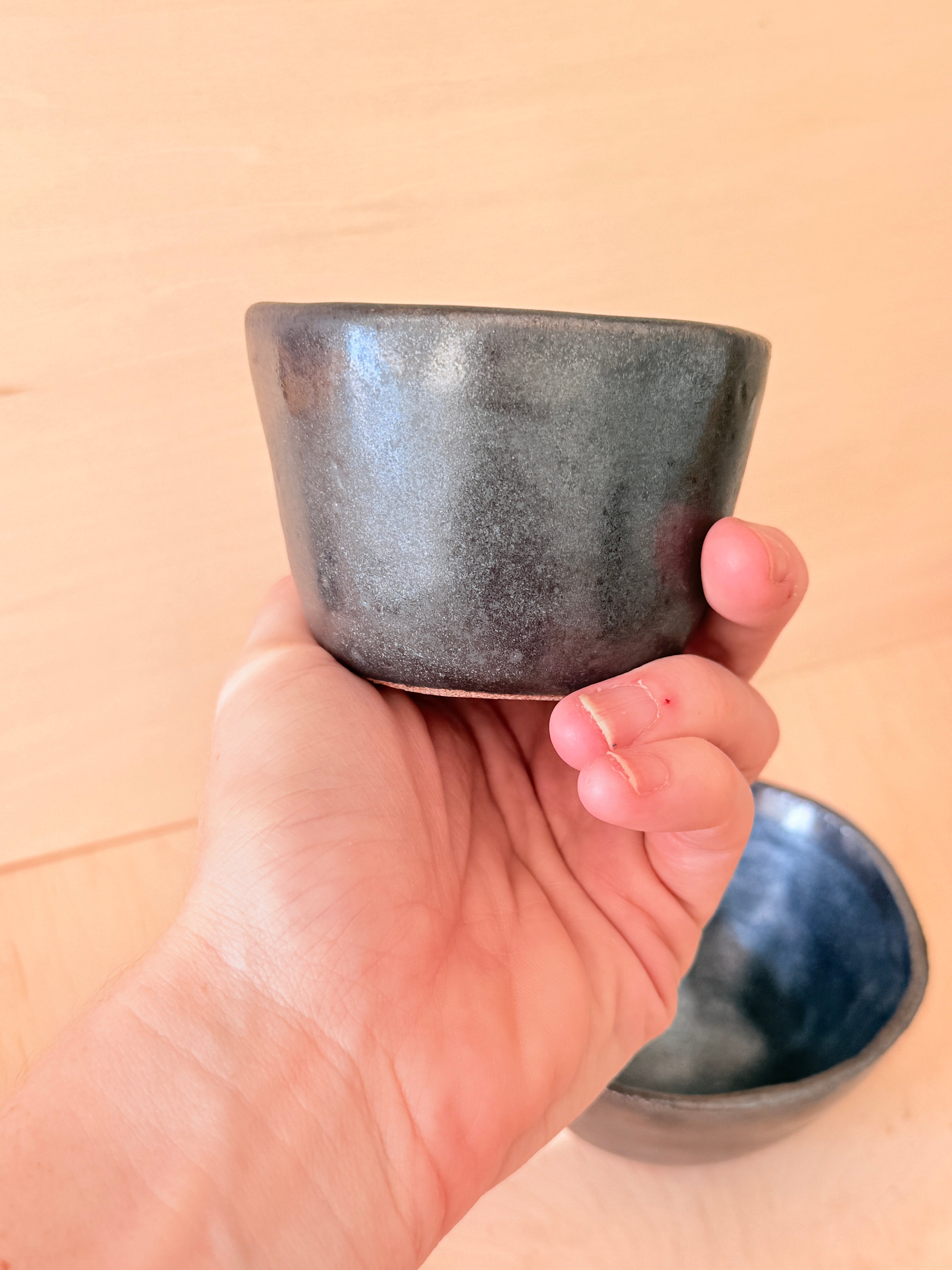 Deep handbuilt stoneware latte cup with metallic black glaze, by Bunzy Ceramics
