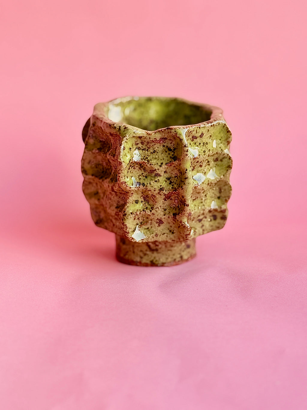 Sculptural green speckled ceramic vase handmade in NYC, angled view