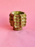 Sculptural green speckled ceramic vase handmade in NYC, angled view