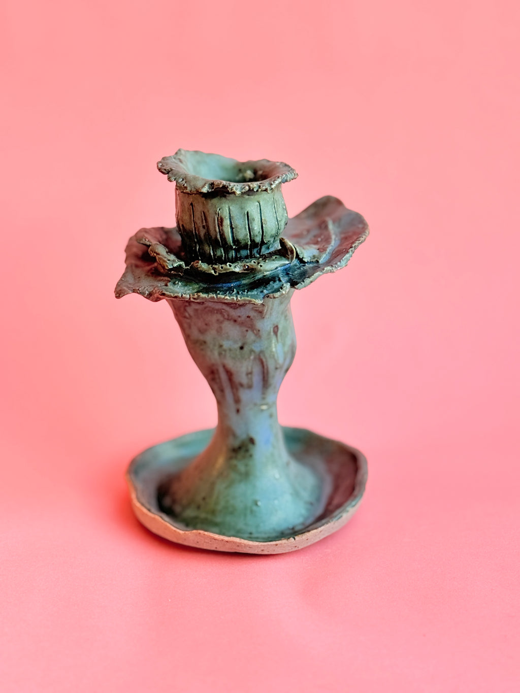 Handbuilt ceramic blue candle holder with sculptural floral form