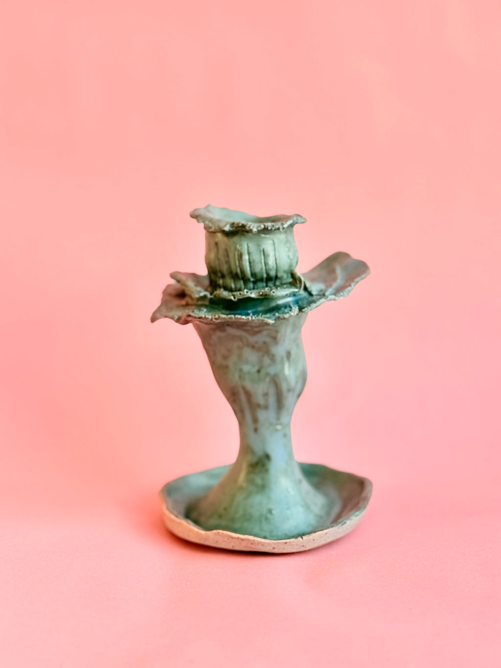 Side profile of handbuilt ceramic blue candle holder, handmade in NYC