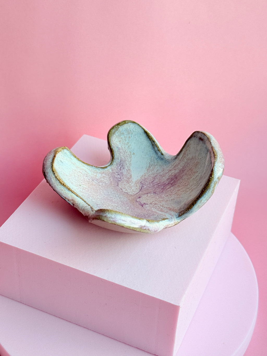 Close-up of handbuilt ceramic trinket dish showing soft texture and glossy finish