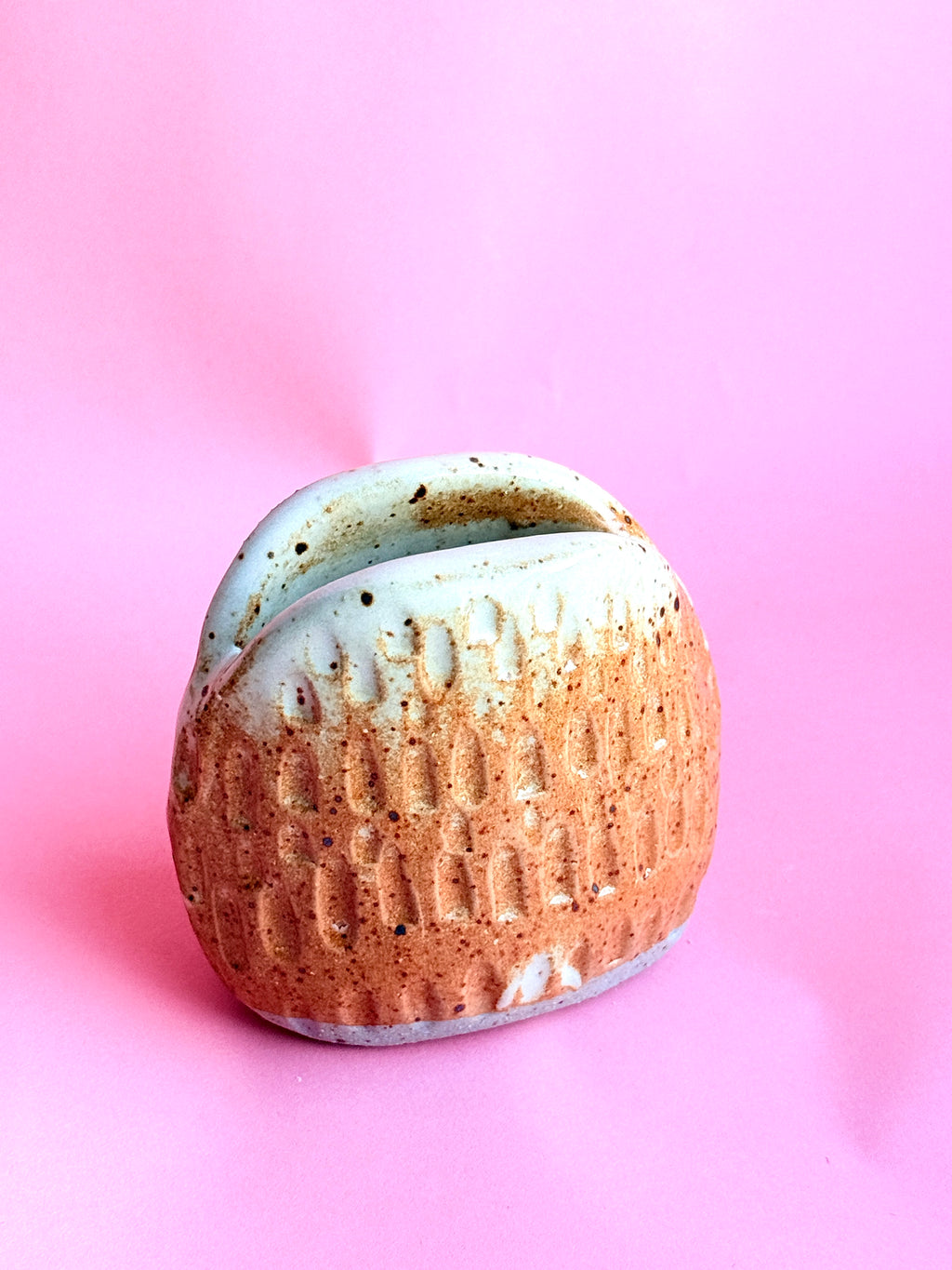 Textured handmade ceramic bud vase with warm speckled glaze