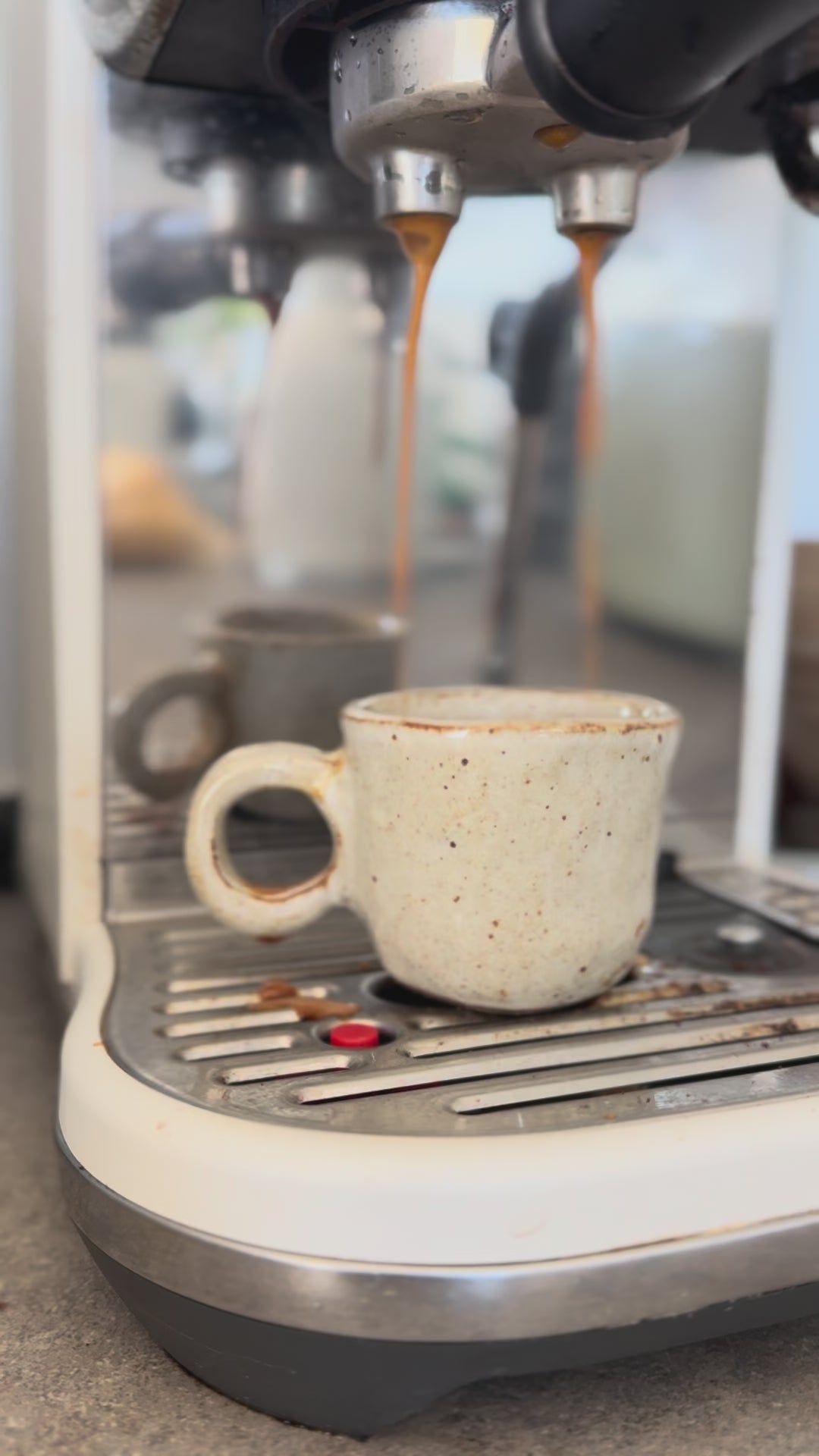 Video of espresso shot being poured into mini ceramic cup