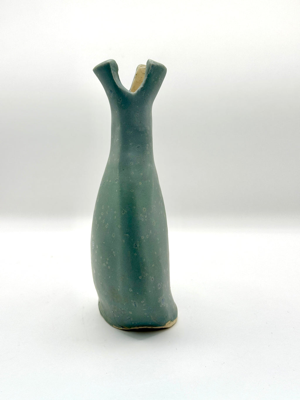 side profile of organic vase with speckled blue glaze made by Bunzy 